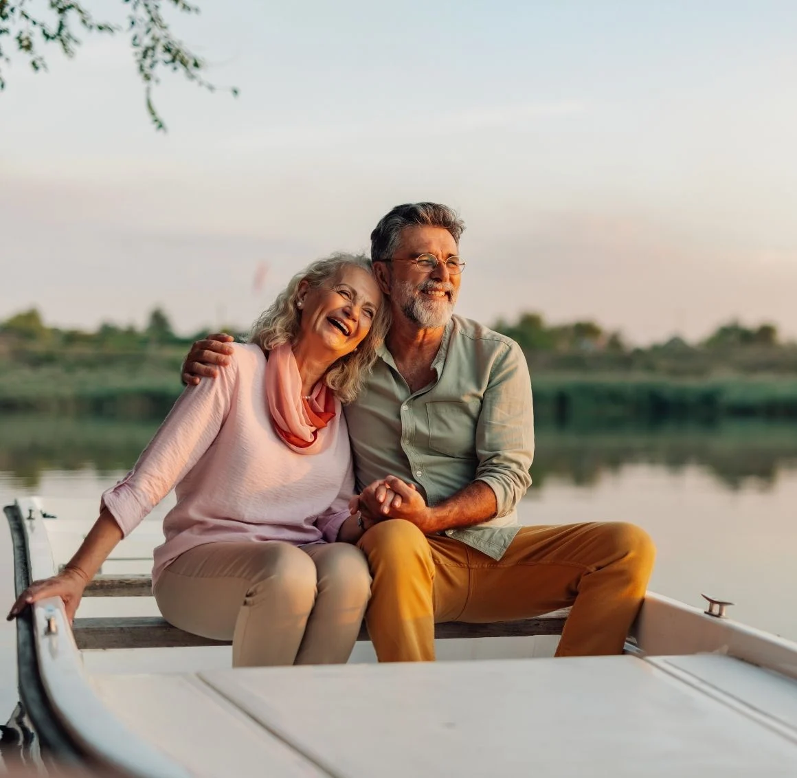 senior-couple-laughing-in-boat-on-lake respite care brings peace of mind