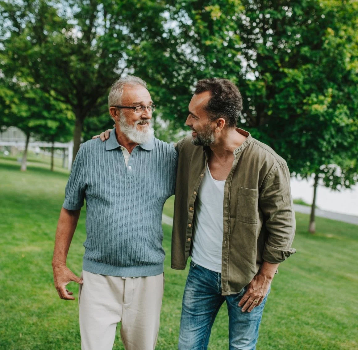 senior-father-and-son-walking-together-in-park